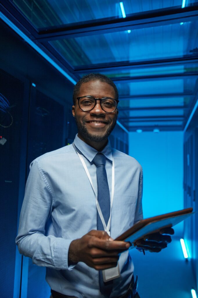 Smiling African American Man in Server Room