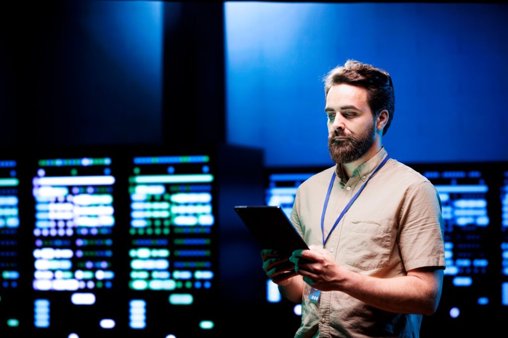 Admin walking in high tech data center
