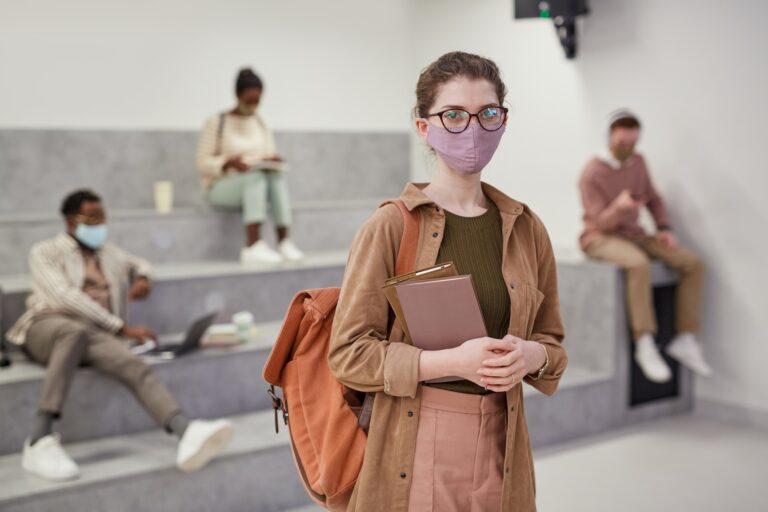 Portrait of Young Woman Wearing Mask in College