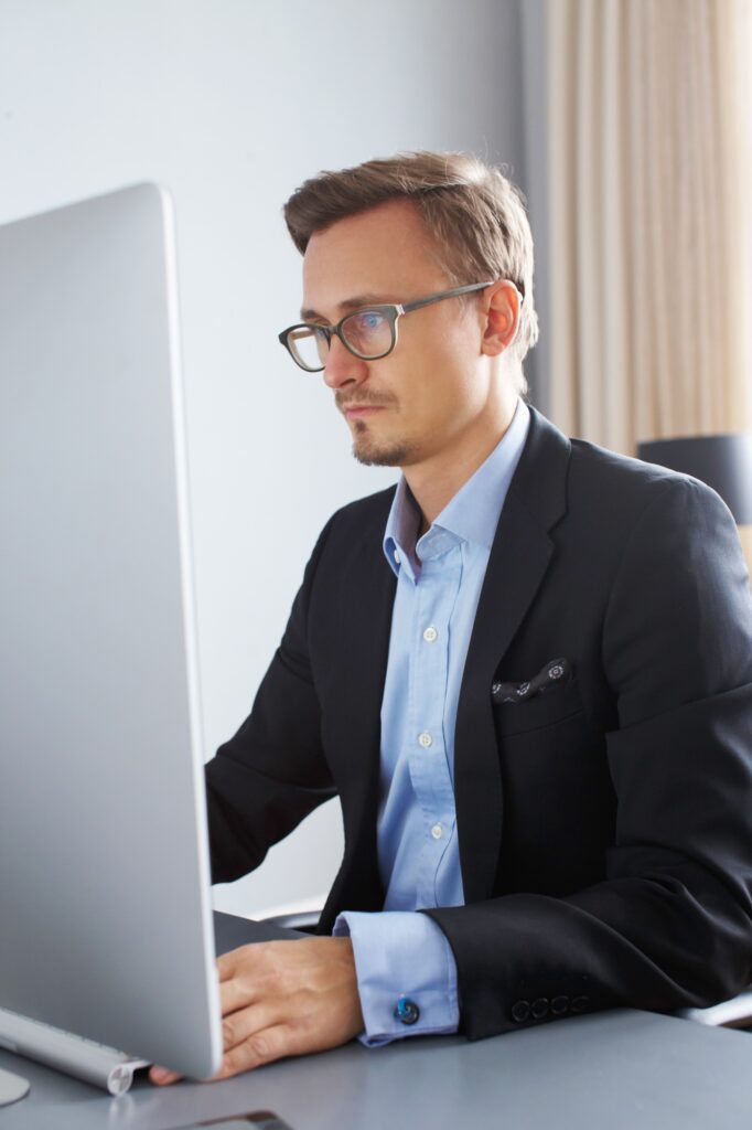 Handsome business man working with computer.