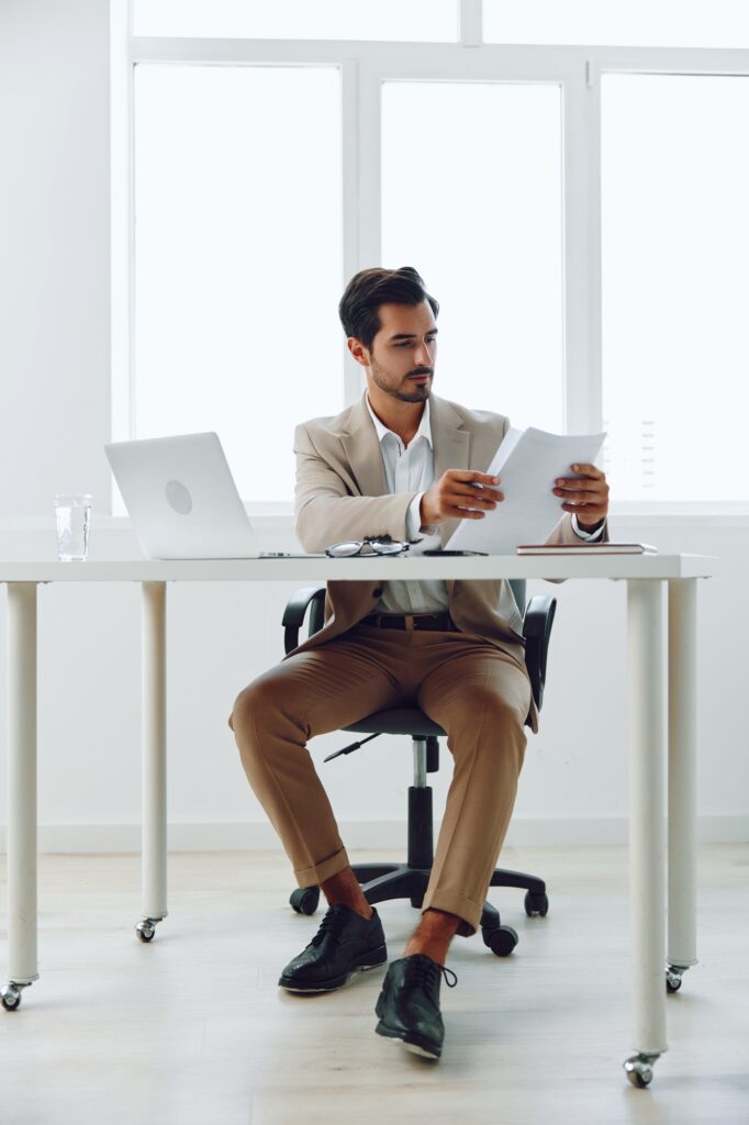 Laptop office holding businessman paper planning