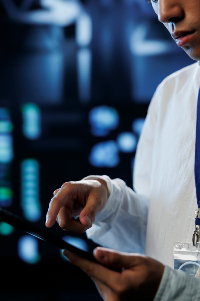Scientist in data center with tablet