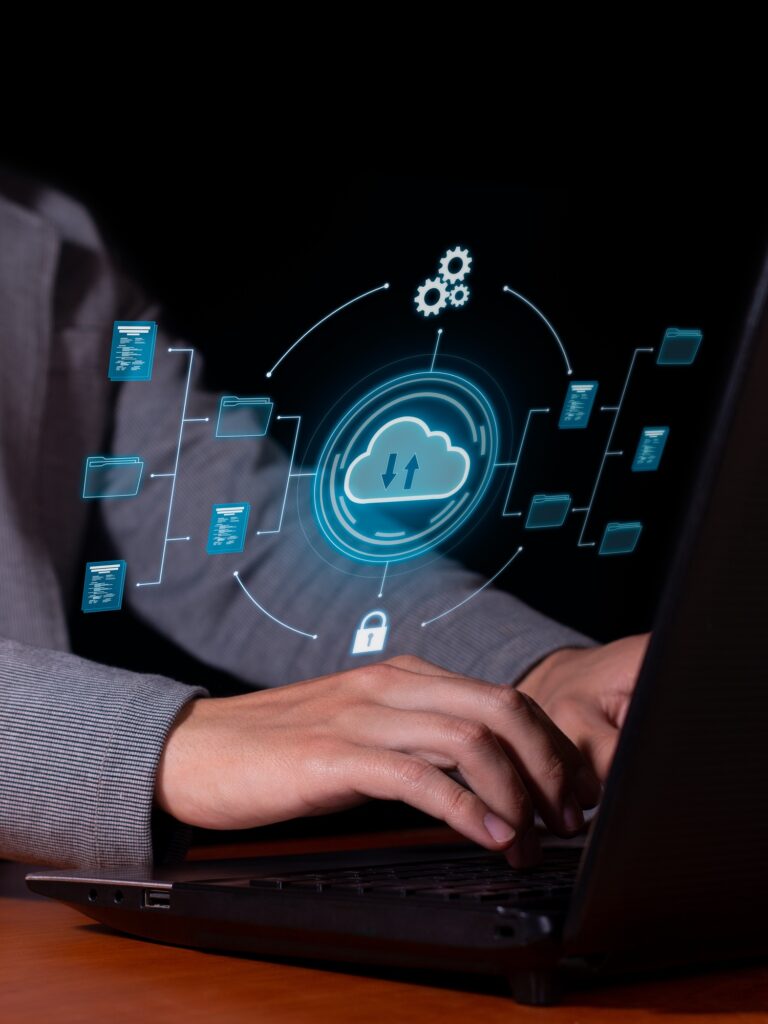 Vertical photo of a Man uses cloud computing on his computer to transmit.