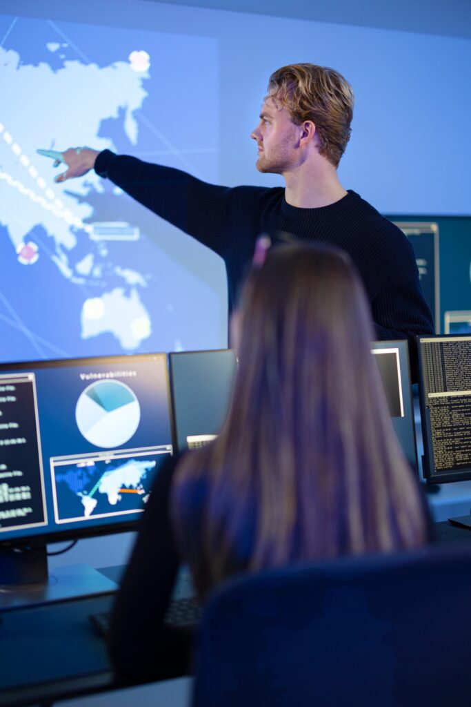 Cyber security team working in a Cyber Security Operations Center SOC to protect datacenter from