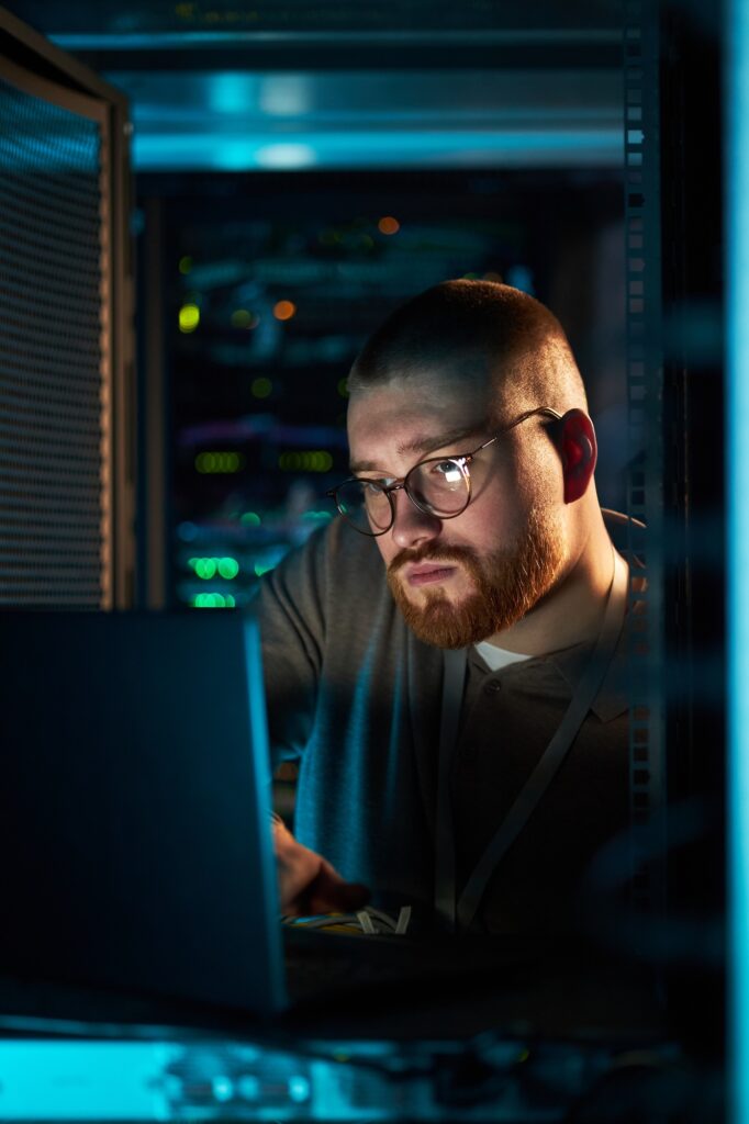Working on Laptop in Data Center with Servers