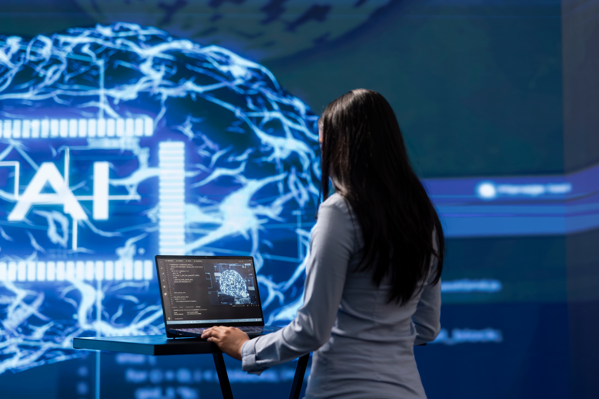 Admin using laptop to maintenance artificial intelligence neural networks