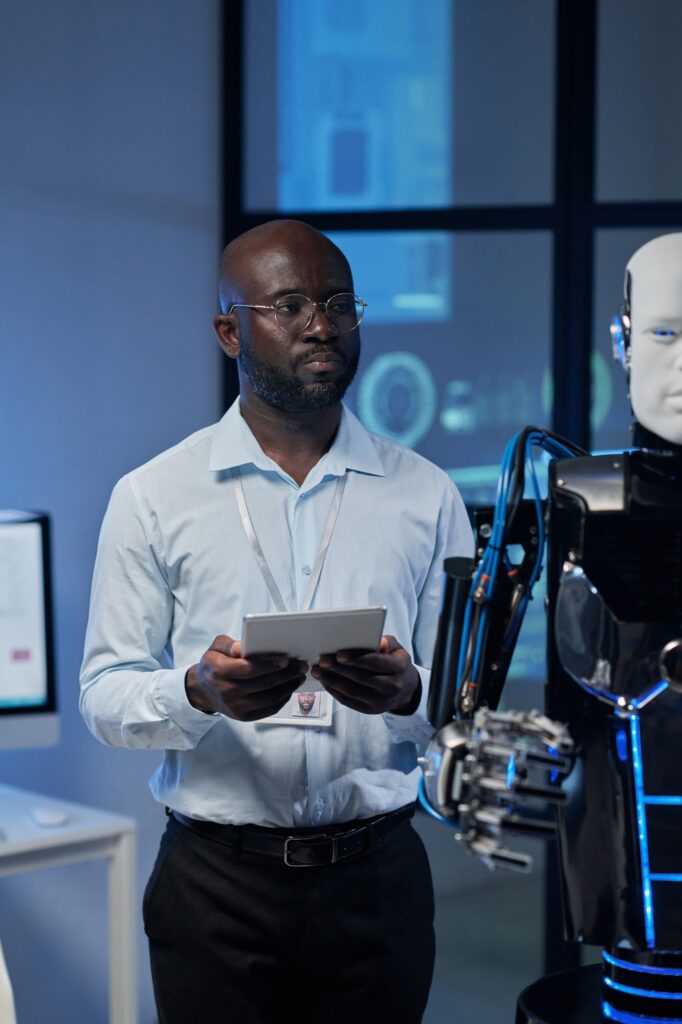Man using tablet pc to control the robot